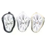 horloges murales surréalistes dali or noir argent chiffres romains aiguilles forme organique transparentes salon