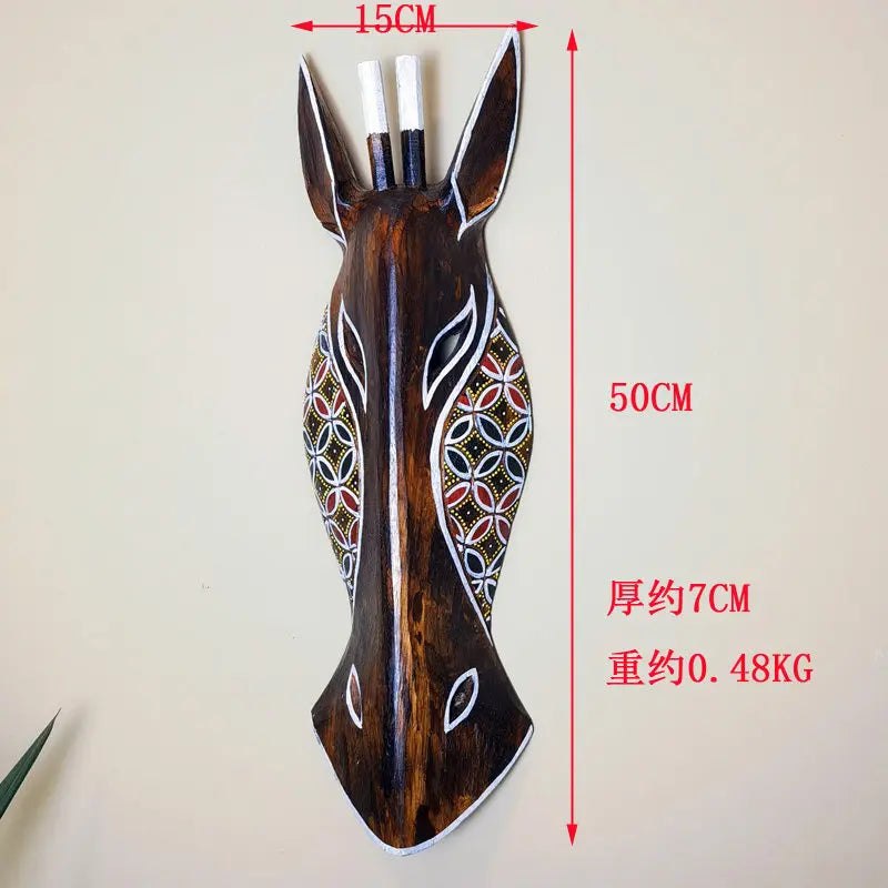 masque bois opaque traditionnel animal africain motifs géométriques décorative salon chambre rouges jaunes blancs