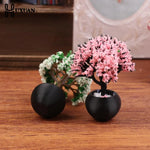 décoration intérieure plante artificielle fleurs feuilles pot terre cuite galets blancs moderne minimaliste
