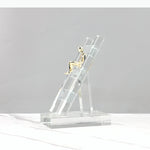 support smartphone transparent moderne figurine dorée minimaliste chambre