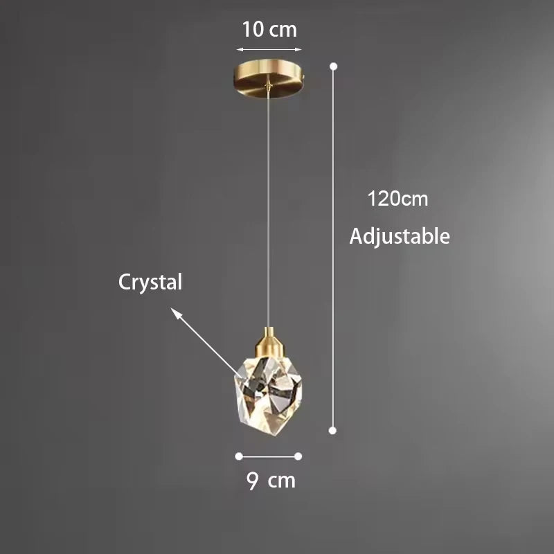 lampe suspendue or transparent cristal facettes géométriques moderne élégante tringles câbles