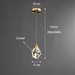 lampe suspendue or transparent cristal facettes géométriques moderne élégante tringles câbles
