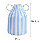 vase decoratif porcelainne stripes motif visage stylise decoration table centerpiece fleurs