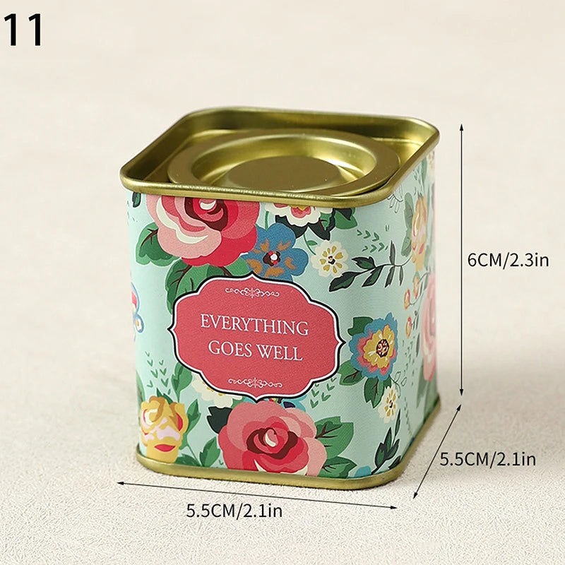 boîtes métal bleu rose noir fleurs vintage capsules étiquettes messages conservation snacks thé