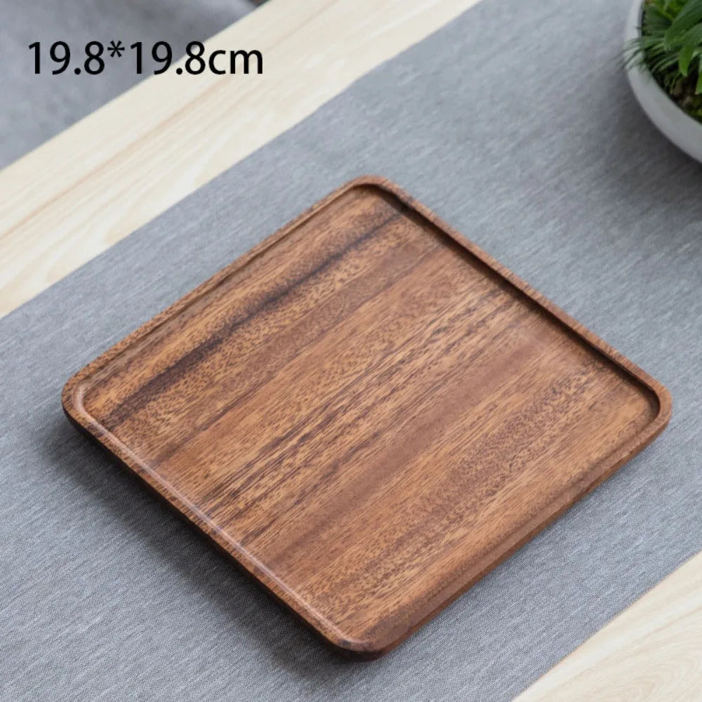 assiettes bois marron clair feuilles modernes métalliques thé tasses théière fruits noix