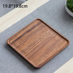 assiettes bois marron clair feuilles modernes métalliques thé tasses théière fruits noix