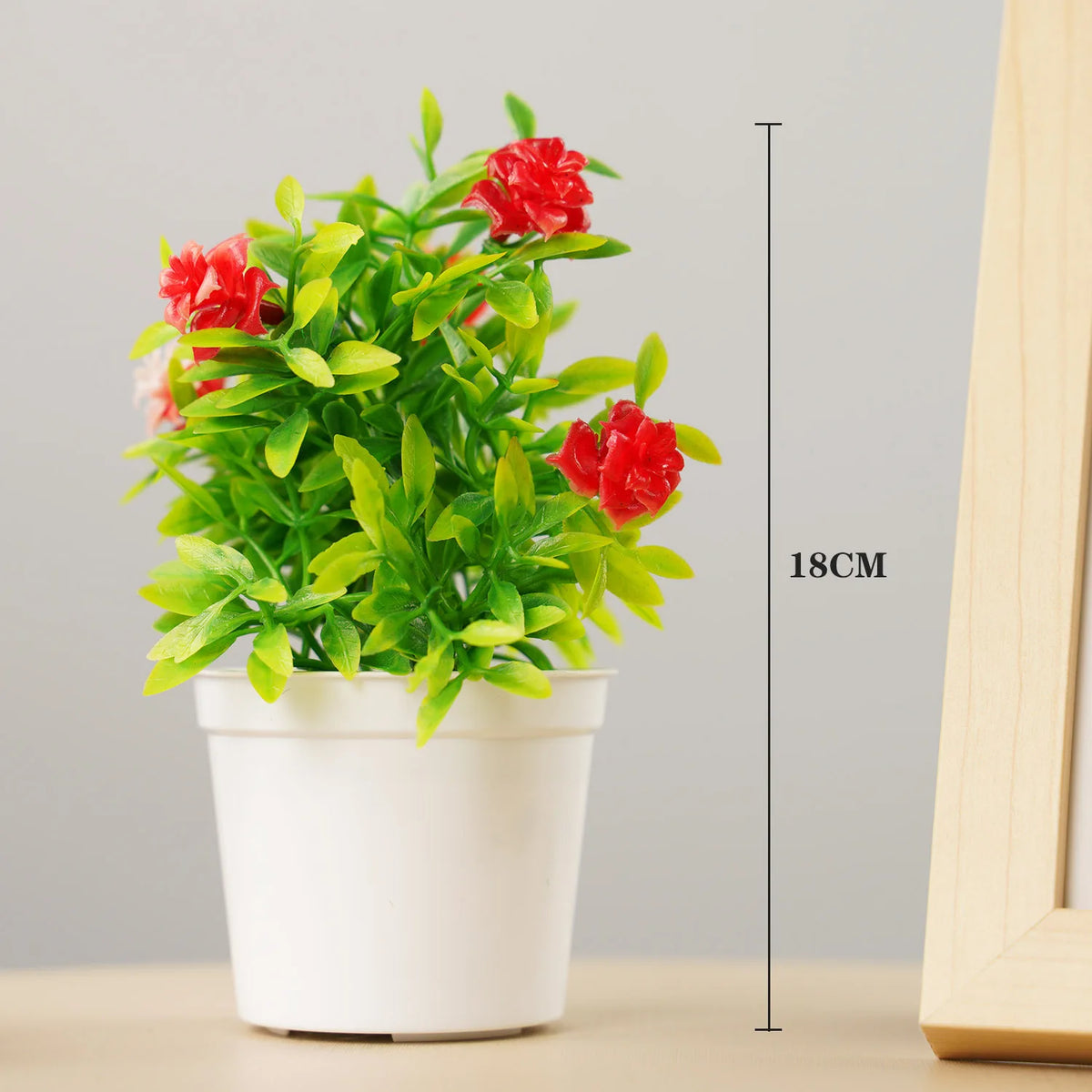 plante artificielle bonsaï pot blanc feuilles vertes fleurs rouges violettes décoration intérieure extérieure moderne
