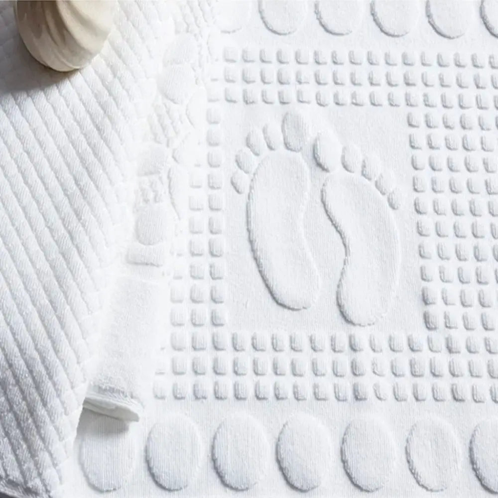 tapis bain moderne blanc motifs pieds géométriques salle bain absorbant coton décoration cheveux fleurs