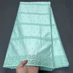 tissu brodé vert clair beige bleu coton opacité résistance brocart dobby haute qualité
