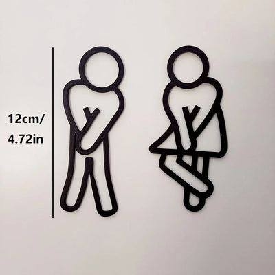 signalisation toilettes homme femme pictogrammes relief surface mate noir blanc minimaliste humoristique sans électricité