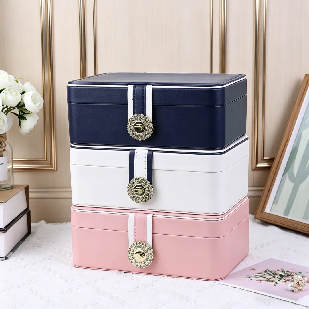 boîtes bijoux simili cuir bleu marine blanc rose pâle compartiments montres boucles doreilles modernes
