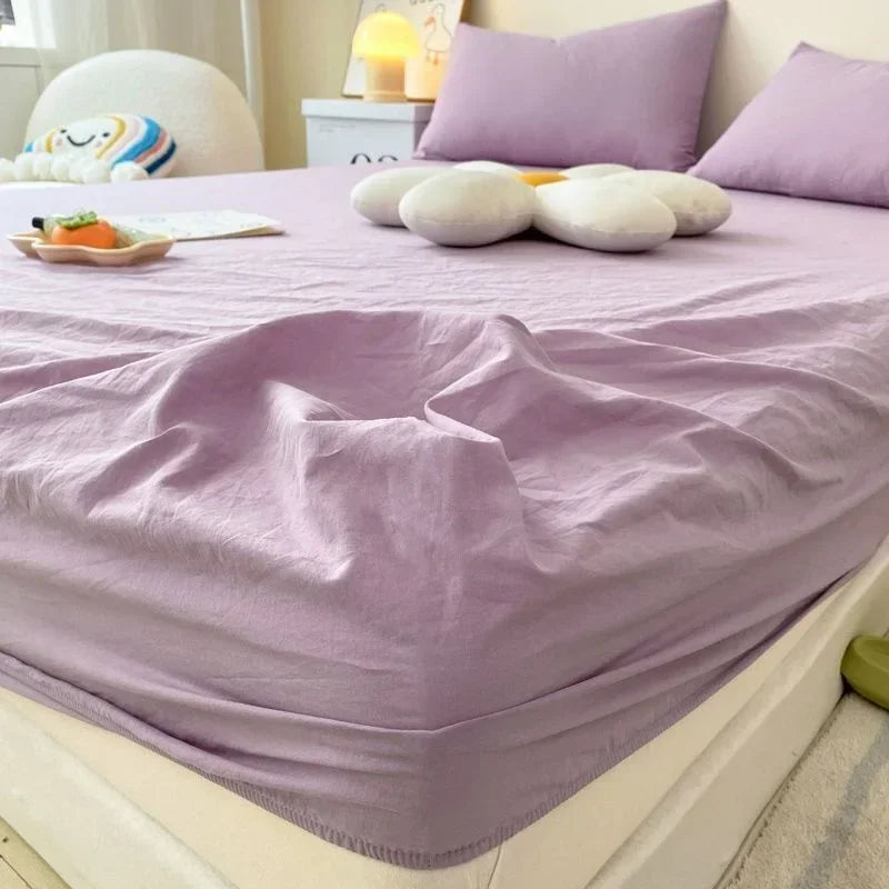 protège matelas carreaux bleu clair gris clair rose clair jaune clair vert clair classique