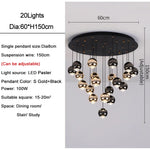 suspension lumineuse contemporaine noir doré sphères métalliques brillantes éclairage intérieur maison
