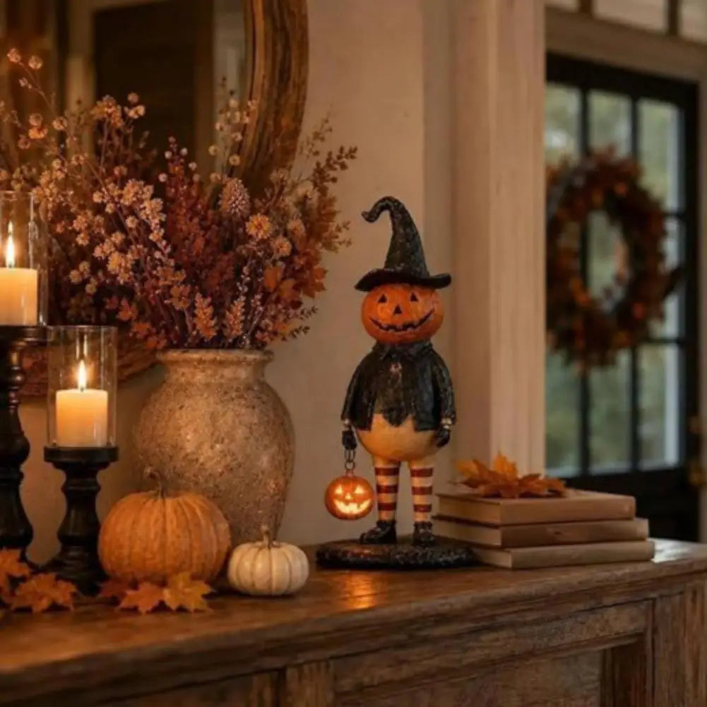 figurine citrouille halloween orange chapeau robe noire bas sculptée décoration intérieure festive