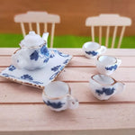 service thé miniature blanc bleu fleurs classique théière crème sucrier tasses assiettes