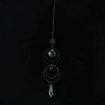 bijou pendentif cristal or bleu violet vert formes géométriques motifs oculaires translucides boho chic