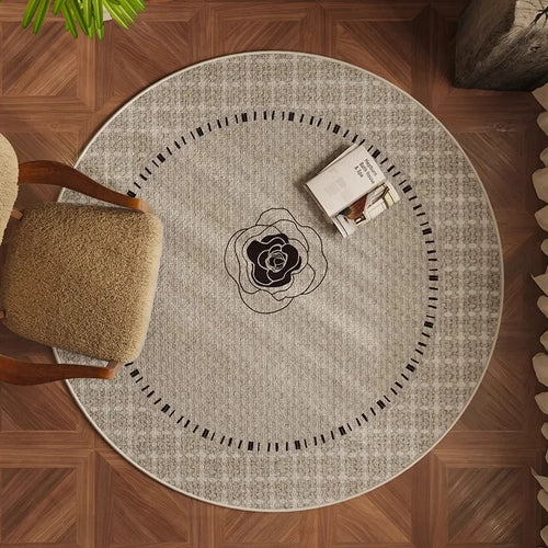 tapis rond beige clair moderne texture tissée motifs géométriques salon chambre intérieur maison