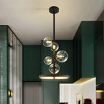 suspension lumineuse moderne sphères verre transparent anneaux métalliques noir doré grisclair