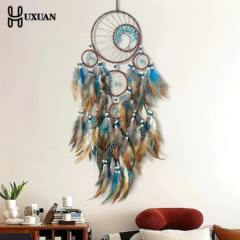 attrape rêves ethnique attrape rêves artisanal plumes bois marron bleu gris blancsuspendu fil