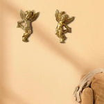 statues d'anges dorées détails sculpturaux classiques brillants intérieur chambre salon