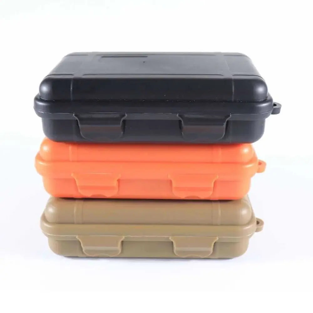 boîtes rangement voyage noires oranges beiges opaques pratiques robustes poignées empilablesextérieur camping