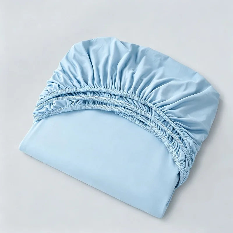 parure lit bleu clair drap housse élastique deux oreillers coton doux chambre moderne