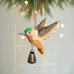 pendentif oiseau suspendu bois artisanal cloche métallique vert rose marron origami rustique