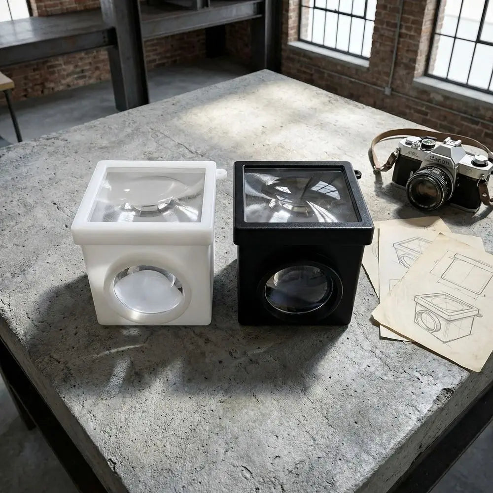 cube optique contemporain noir blanc objectif optique portable studio matériau opacique