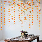guirlandes papier orange blanc cercles décoration anniversaire mariage fêtes automne Thanksgiving