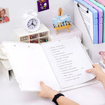 Comparaison taille boîte rangement A4 avec documents