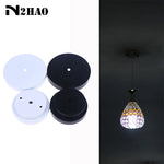 disques suspension lampes blanc noir ronds lisses modernes vis fixations bouchons protection