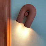 lampes murales modernes bleu turquoise noir blanc cassé rouille sculpturales éclairage quotidien minimaliste fixées