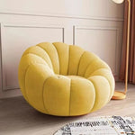fauteuil moderne velours bouclé doux repos pieds beige clair intérieur meubles salon contemporain