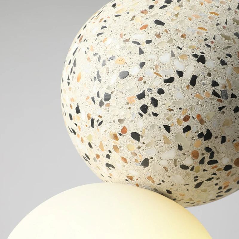 suspension lumineuse moderne ampoules led blanc noir rose gris texture granulée câble suspendu minimaliste