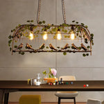 suspension lumineuse vintage oiseaux métal feuilles vert ampoules noir doré rustique