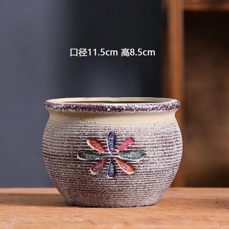 cache pot céramique artisanal méditerranéen couleurs vives motifs texturés plante verte intérieur moderne