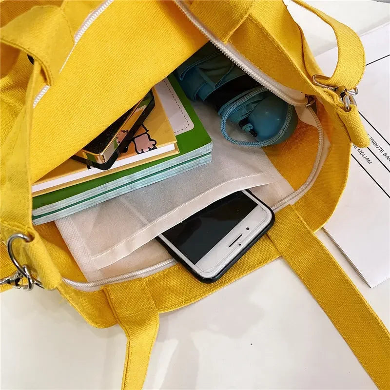 sac main uni jaune blanc vert noir moderne poignées détachables porte clés poche avant