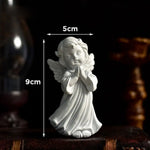 statuette ange résine blanche classique livre coquillage ornement sans odeur sculpteur fée