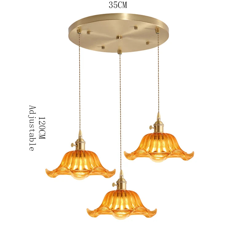 suspension lumineuse vintage vert doré motifs géométriques ampoules câbles chaînes métal