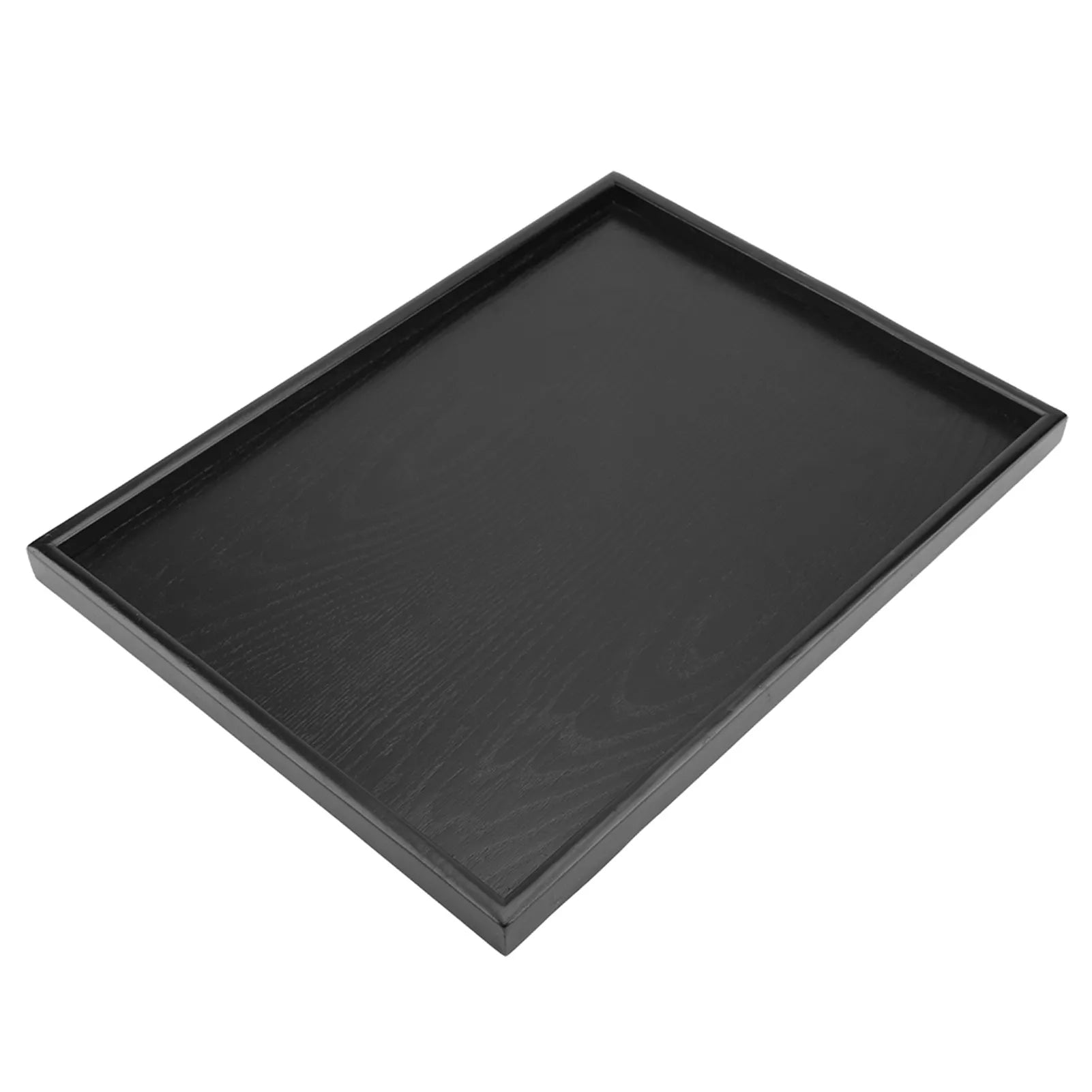 Plateau en bois rectangulaire noir sur table avec thé et pâtisseries