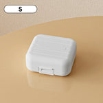 boîte pilules moderne blanc rose compartiments semaines verrouillable pratique adhésif organisateur médicaments portable