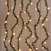 guirlande lumineuse roses artificielles feuillage vert led decoration intérieure romantique champêtre festive maison