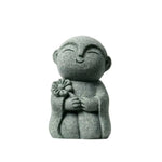 statuette bouddhiste vert clair granitée minimaliste sculptural durable extérieure intérieure ornement jardin porte bonheur