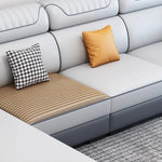 canapé d'angle moderne gris clair gris foncé beige noir tissu rayures géométrique coussins