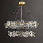 suspension lumineuse moderne dorée transparente disques circulaires texture rugueuse contemporaine élégante chaînes suspendues LED