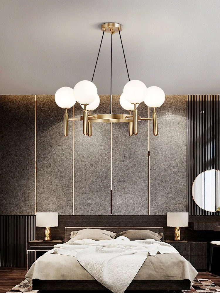 suspension lumineuse moderne or noir sphères translucides métal poli élégante led chambre salon