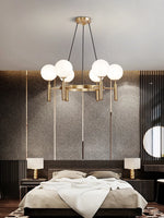 suspension lumineuse moderne or noir sphères translucides métal poli élégante led chambre salon