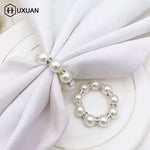 anneau serviette strass dorés classique élégant blanc or événements table luxueux fixations