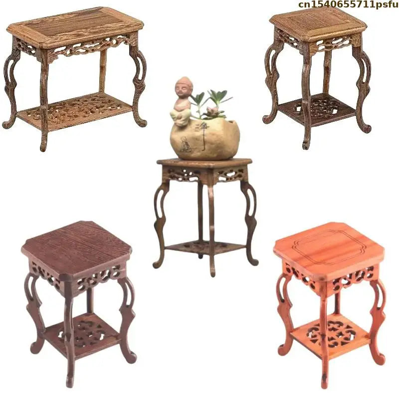 table basse bois rose classique gravures artisanal marron clair pot plante figurine cadre photo