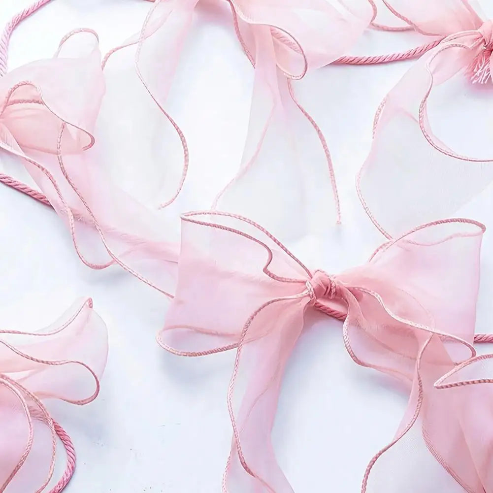 décoration festive guirlande nœuds rose tissu texturé semi transparent mariage anniversaire enfant baby shower